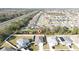 Aerial view of a single-Gathering home in a residential neighborhood with mature trees and landscaping at 3573 Bristol Cove Ln, St Cloud, FL 34772