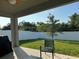 Covered back porch with a ceiling fan and a comfortable seating area, perfect for relaxation at 3573 Bristol Cove Ln, St Cloud, FL 34772