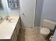 Bathroom with toilet and sink vanity at 3854 Southpointe Dr # 1, Orlando, FL 32822