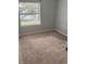 Bright bedroom featuring carpet and a large window at 3854 Southpointe Dr # 1, Orlando, FL 32822