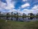 Tranquil community view with waterfront and lush greenery at 3854 Southpointe Dr # 1, Orlando, FL 32822