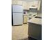 Small kitchen with white appliances and light countertops at 3854 Southpointe Dr # 1, Orlando, FL 32822