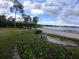 Relaxing lakefront area with gazebo and benches at 3854 Southpointe Dr # 1, Orlando, FL 32822