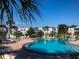 Community swimming pool with plenty of lounge chairs at 3854 Southpointe Dr # 1, Orlando, FL 32822