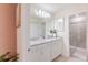 Double vanity bathroom with a walk-in shower at 4154 Lana Ave, Davenport, FL 33897