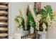 Reflective mirror displays stylish vases with pampas grass and flowers at 4154 Lana Ave, Davenport, FL 33897