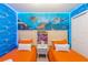 Twin bedroom with ocean mural and LED lighting at 4154 Lana Ave, Davenport, FL 33897