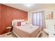 Bright bedroom with a comfortable queen-size bed and stylish decor at 4154 Lana Ave, Davenport, FL 33897