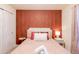 Cozy bedroom featuring a comfortable bed and accent wall at 4154 Lana Ave, Davenport, FL 33897