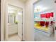 Fun bunk bed room with playful decor and ensuite bathroom at 4154 Lana Ave, Davenport, FL 33897