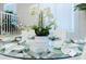 Elegant dining room with glass table and seating for six at 4154 Lana Ave, Davenport, FL 33897