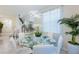 Bright dining room with glass table and white chairs at 4154 Lana Ave, Davenport, FL 33897