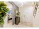 Bright entryway with a view of a bedroom, console table, and patterned rug at 4154 Lana Ave, Davenport, FL 33897