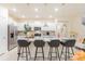 Modern kitchen with white cabinets and granite island at 4154 Lana Ave, Davenport, FL 33897