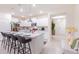 Modern kitchen with white cabinets and granite island at 4154 Lana Ave, Davenport, FL 33897