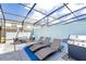 Relaxing outdoor patio with lounge chairs and grill at 4154 Lana Ave, Davenport, FL 33897