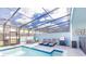 Inviting pool and spa with covered patio and lounge chairs at 4154 Lana Ave, Davenport, FL 33897