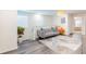 Cozy sitting area with gray sofa and orange accent chair at 4154 Lana Ave, Davenport, FL 33897