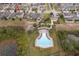 Aerial view showing community pool, playground, and homes at 437 Seattle Slew Dr, Davenport, FL 33837