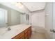 Full bathroom with shower/tub combo, vanity with wood cabinets at 437 Seattle Slew Dr, Davenport, FL 33837