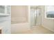 Bathroom with a shower, soaking tub, and built-in shelving at 437 Seattle Slew Dr, Davenport, FL 33837
