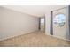 Bright bedroom with neutral walls, carpet, and large windows at 437 Seattle Slew Dr, Davenport, FL 33837