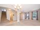 Open floor plan dining room with neutral carpeting and tile flooring at 437 Seattle Slew Dr, Davenport, FL 33837