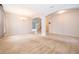 Open floor plan dining room with neutral carpeting and tile flooring at 437 Seattle Slew Dr, Davenport, FL 33837