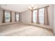 Formal dining room with neutral decor and natural light from large windows at 437 Seattle Slew Dr, Davenport, FL 33837