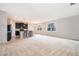Modern kitchen with dark cabinets, granite counters and island at 437 Seattle Slew Dr, Davenport, FL 33837