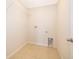 Laundry room with tile floor, shelving and hookups at 437 Seattle Slew Dr, Davenport, FL 33837