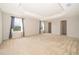 Large main bedroom with plush carpeting and tray ceiling at 437 Seattle Slew Dr, Davenport, FL 33837