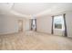 Main bedroom with carpet, large windows, and ensuite bath access at 437 Seattle Slew Dr, Davenport, FL 33837
