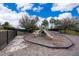 Community playground with playset and safety surfacing at 437 Seattle Slew Dr, Davenport, FL 33837