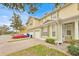 Charming townhome featuring a two-car garage, neutral paint, and landscaped yard at 4990 Alita Ter, St Cloud, FL 34769