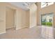 Inviting living room with a vaulted ceiling, tile floor and sliding glass doors to the patio at 4990 Alita Ter, St Cloud, FL 34769