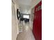 Open entryway with red door, looking towards living room at 511 Kilimanjaro Dr, Kissimmee, FL 34758