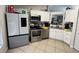 Modern kitchen featuring stainless steel appliances and white cabinetry at 511 Kilimanjaro Dr, Kissimmee, FL 34758