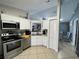 Modern kitchen with white cabinets and stainless steel appliances at 511 Kilimanjaro Dr, Kissimmee, FL 34758