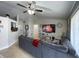Open living room with sectional sofa and view to kitchen at 511 Kilimanjaro Dr, Kissimmee, FL 34758