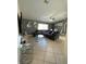 Spacious living room with grey sectional sofa and tile floors at 511 Kilimanjaro Dr, Kissimmee, FL 34758