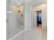 Bathroom with walk-in shower and access to closet at 7211 Still Pond Ln, Windermere, FL 34786