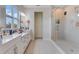 Elegant bathroom with double sinks, large shower, and modern fixtures at 7211 Still Pond Ln, Windermere, FL 34786