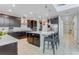 Spacious kitchen featuring a large island and dark cabinetry at 7211 Still Pond Ln, Windermere, FL 34786