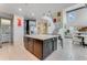 Open concept kitchen with large island and stainless steel appliances at 7211 Still Pond Ln, Windermere, FL 34786