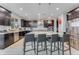 Modern kitchen with island, stainless steel appliances, and dark cabinetry at 7211 Still Pond Ln, Windermere, FL 34786