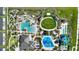 Aerial view of community amenities including pools and a playground at 741 Drop Shot Dr, Davenport, FL 33836