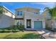 Two-story modern home with stone accents and a landscaped lawn at 741 Drop Shot Dr, Davenport, FL 33836