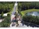 Aerial view of the community entrance with lush landscaping and water features at 8557 La Isla Dr, Kissimmee, FL 34747