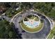Aerial view of the community entrance roundabout featuring a fountain at 8557 La Isla Dr, Kissimmee, FL 34747